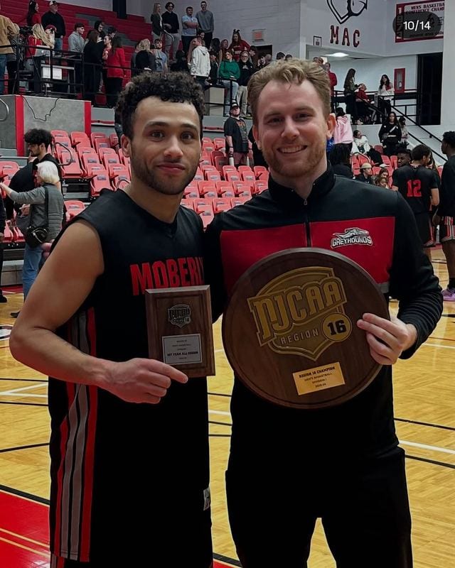 Coach Blake Kingsley with a Moberly Area Community College player holding the NJCAA Region 16 championship plaque