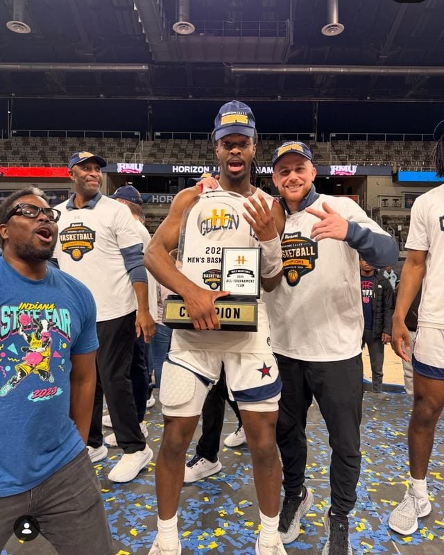 Coach Blake Kingsley celebrating with a Robert Morris All-Tournament Team selection on the court in Indianapolis